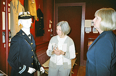 Jennifer Peters of the Collections Committee with Eleanor Brinkerhoff's uniform, courtesy New Canaan Historical Society