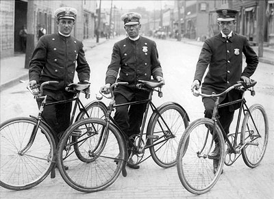 three bicycle policemen, John B. Brennan, Arnold Kurth, and