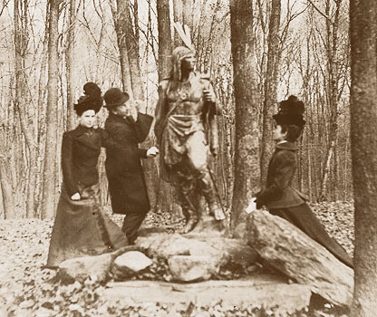 Burleigh Park, undated photo, unidentified people with bronze Indian statue