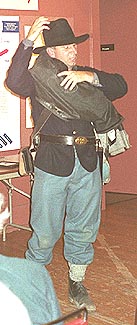 Guy DeMasi demonstrating soldier's gear