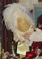 The back view of a lace neck curtain called a bavolet, which covered the nape of the neck on a straw bonnet.