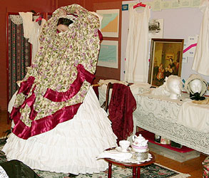 A full skirt fits on top of the  ruffled overpetticoat which covers the hooped crinoline.